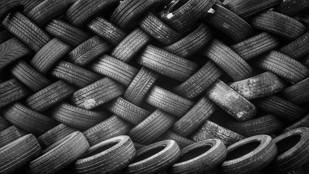 Stacks of tires in a warehouse, ready for retail
